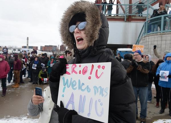 rally for refugees Erie